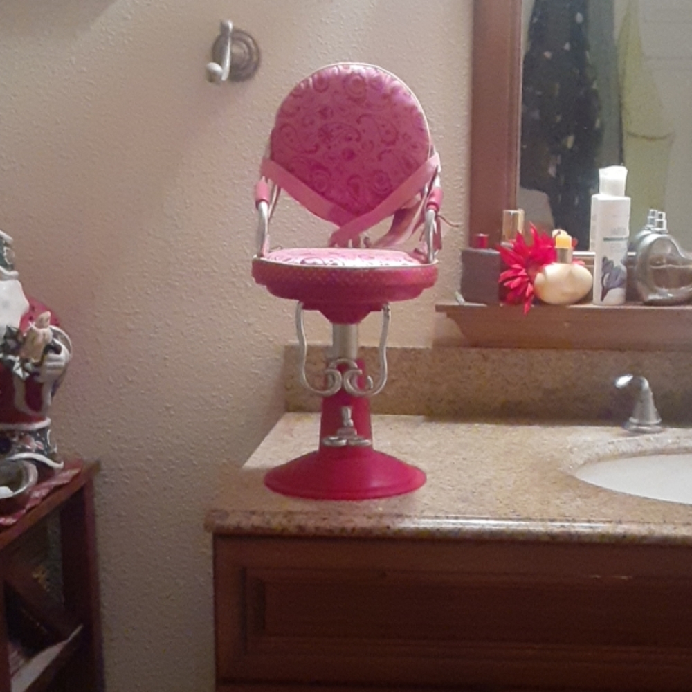 I'm selling a Our Generation doll salon chair